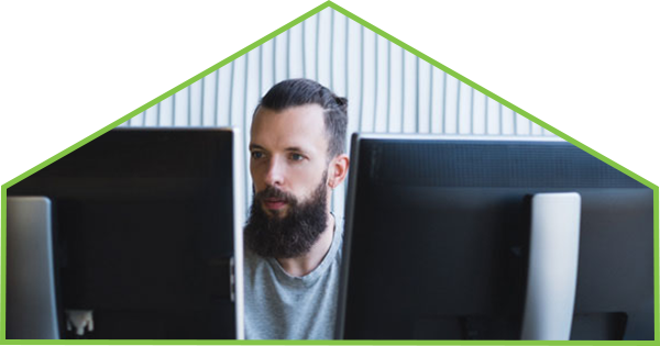 Man in front of computer monitor